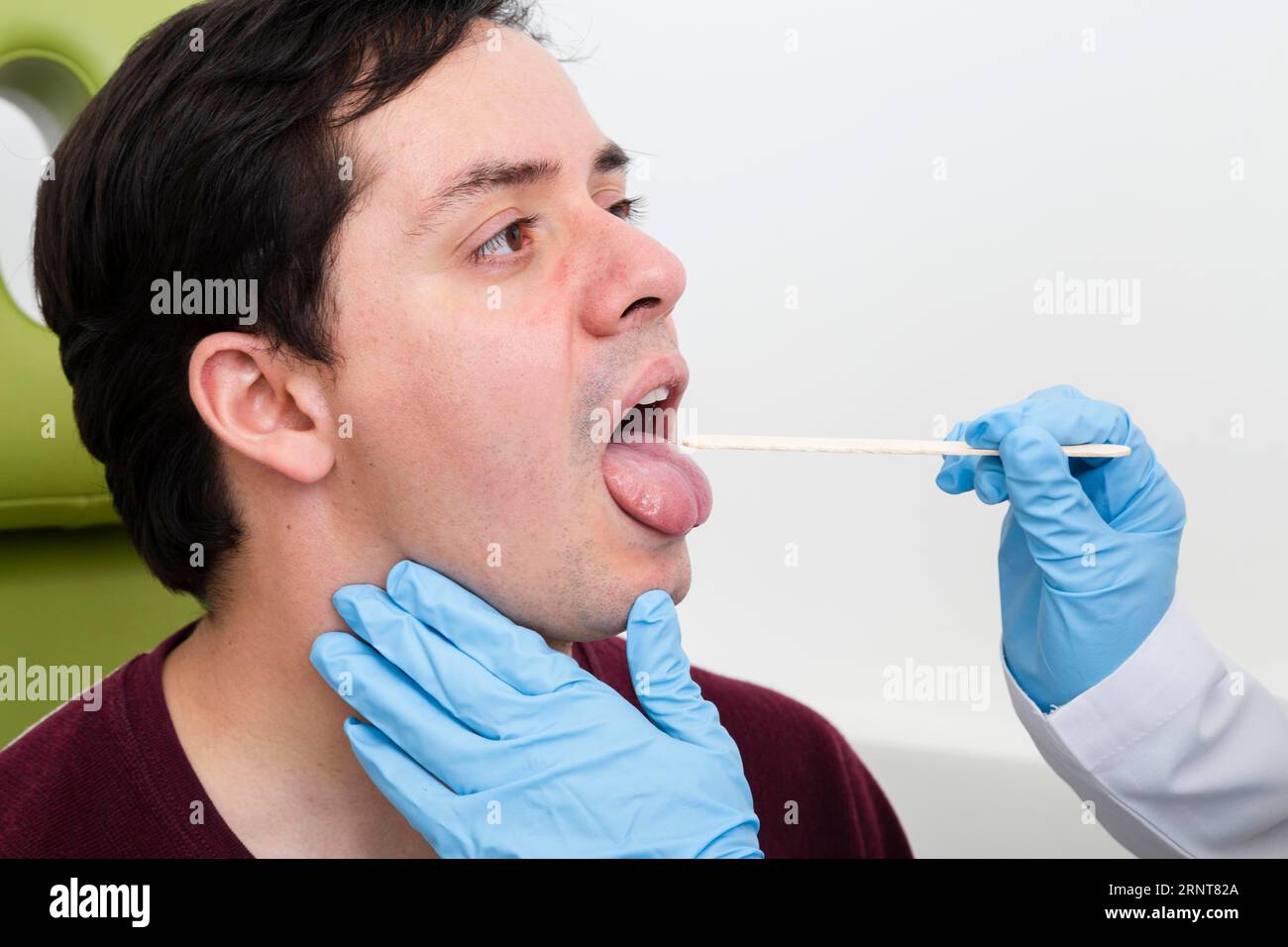 Close up examination with tongue depressor Stock Photo Alamy