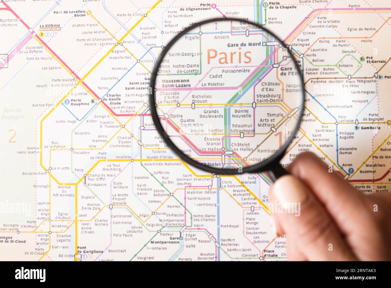 Paris metro map with magnifying glass Stock Photo