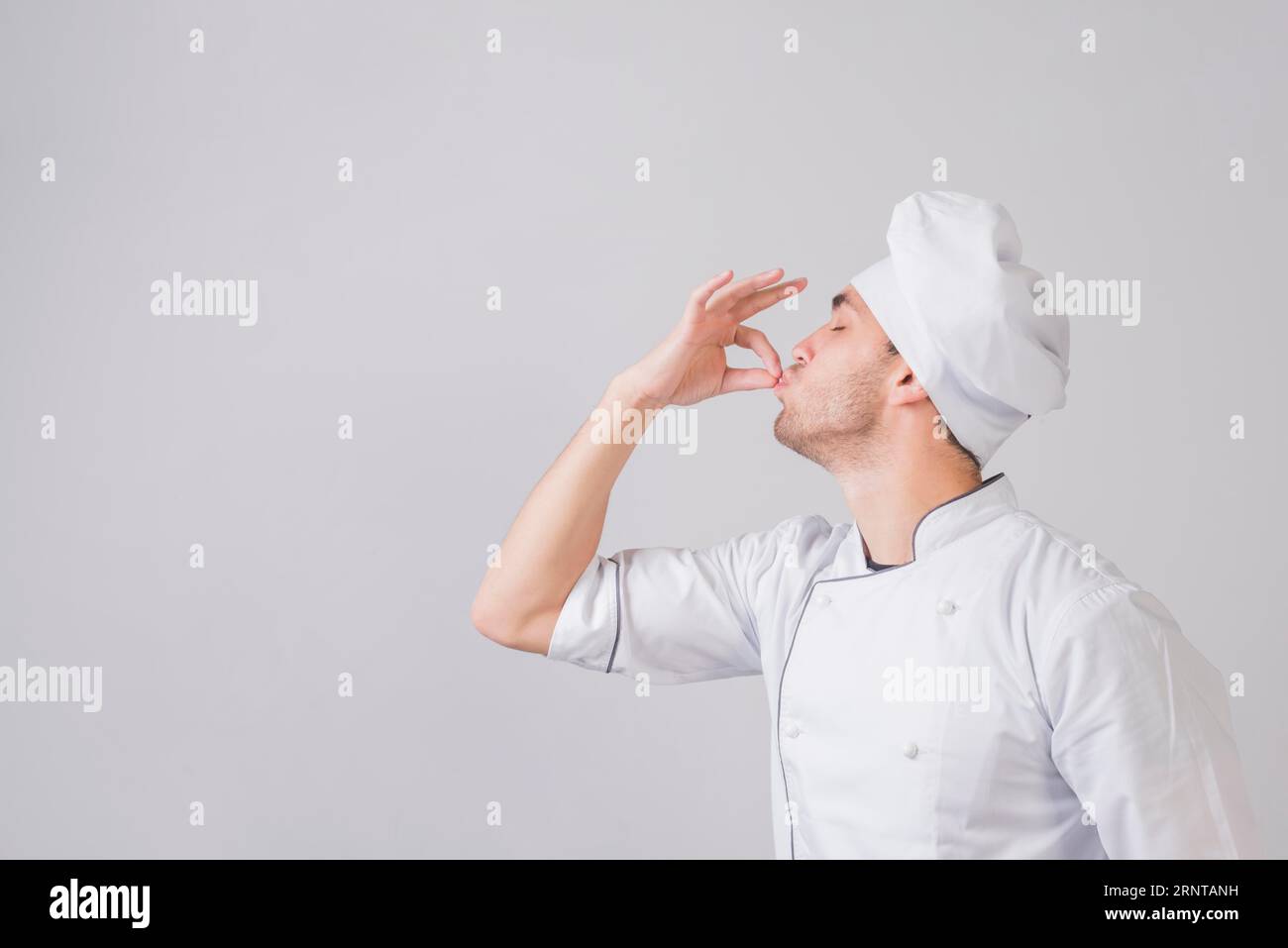 Portrait chef doing tasty gesture Stock Photo