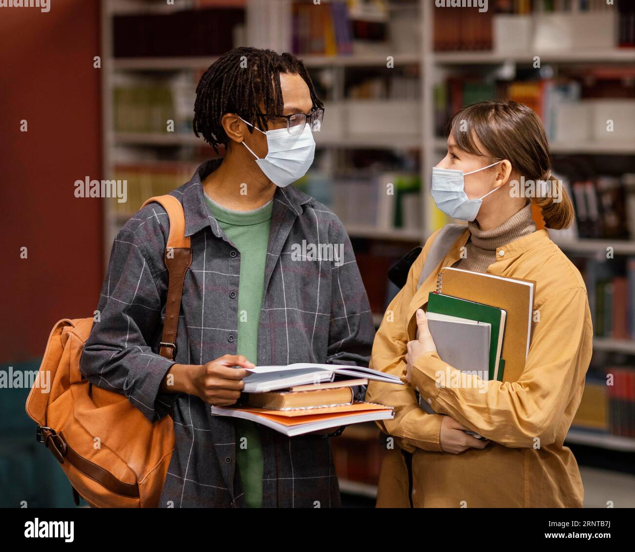 Students wearing medical masks library Stock Photo