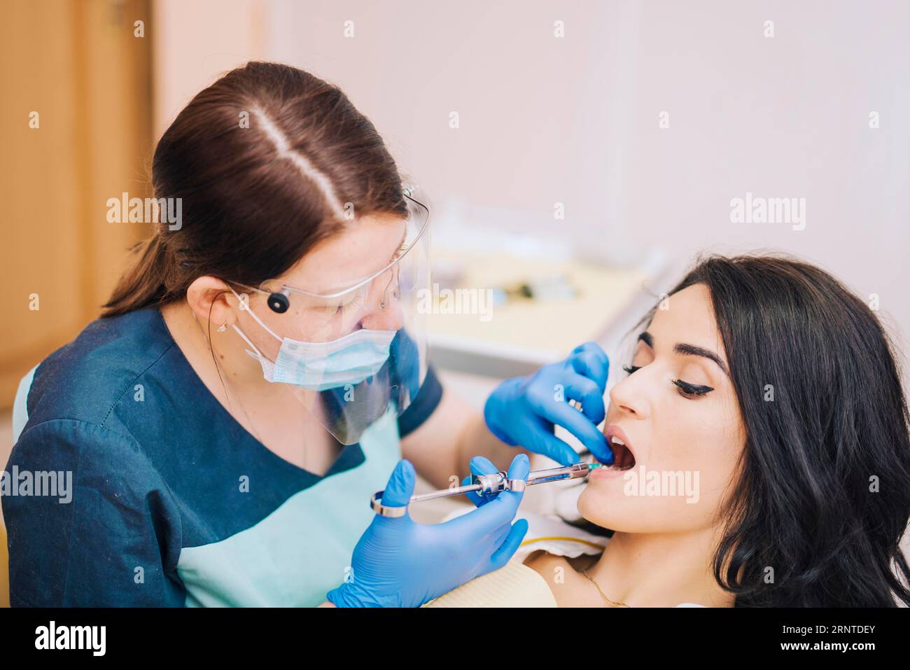 Dentist making anesthetic injection patient Stock Photo