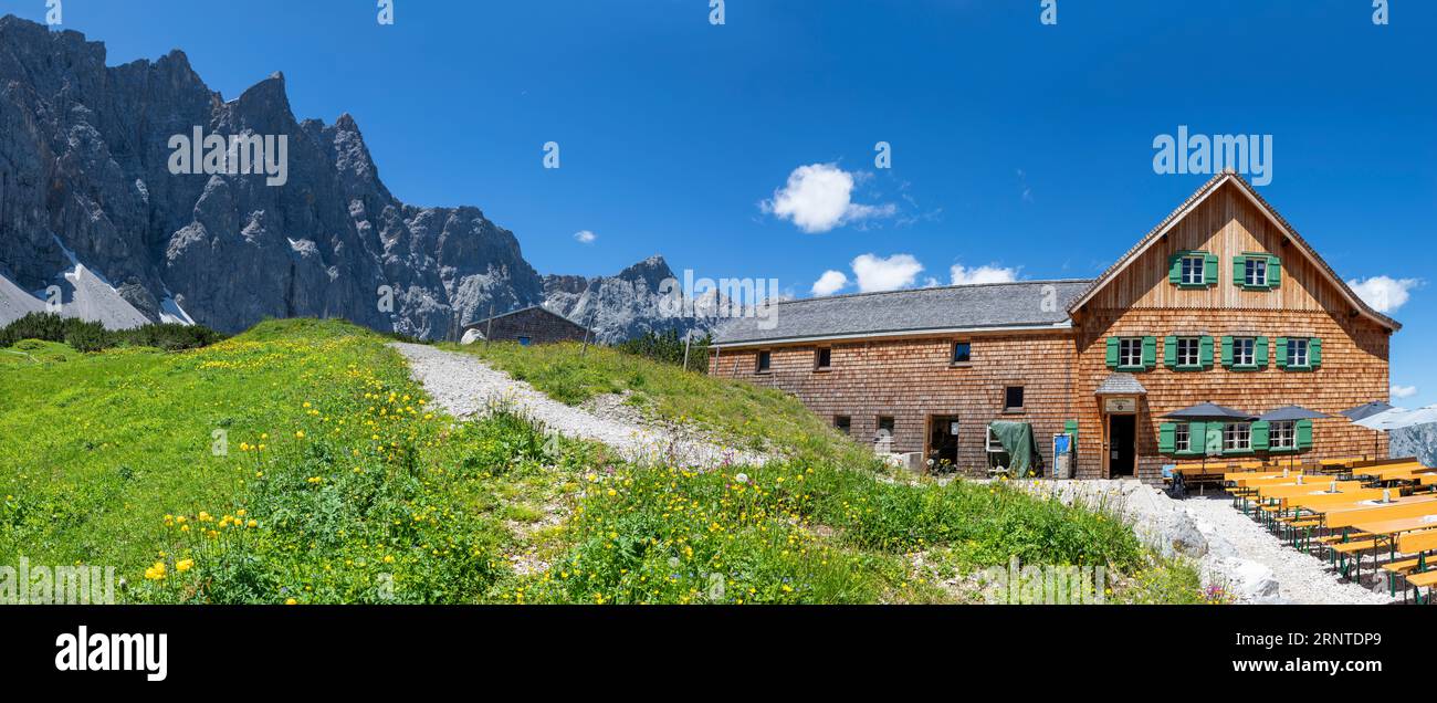 The panorama of north walls of Karwendel mountains - Bockkarspitzhe, Nordliche Sonnenspitze with the Falkenhutte chalet. Stock Photo