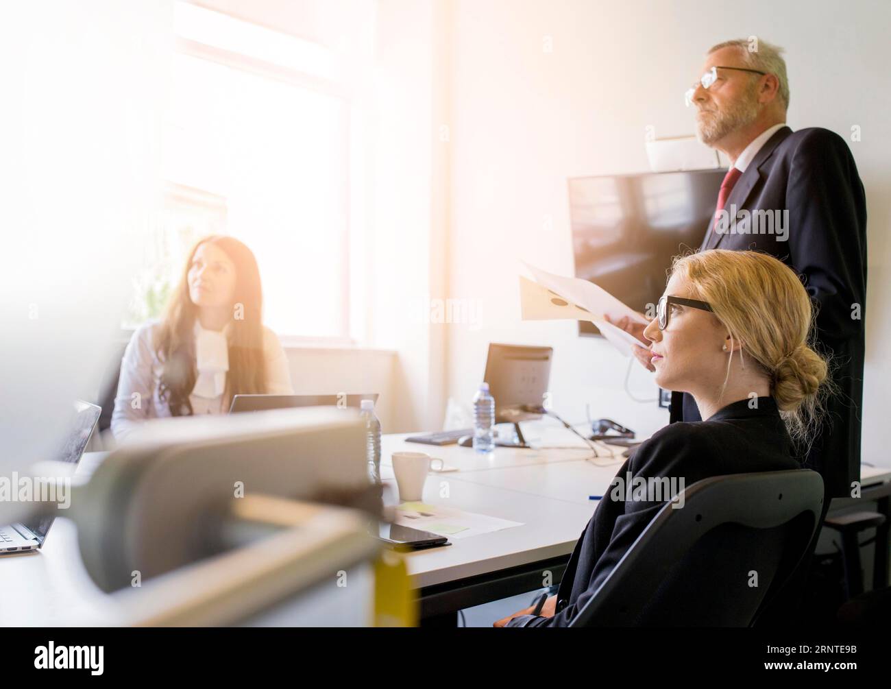 Group businesspeople attending presentation office Stock Photo