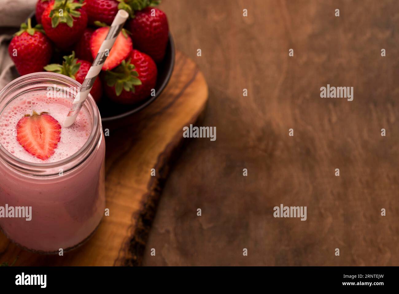 High angle strawberry milkshake with straw copy space Stock Photo