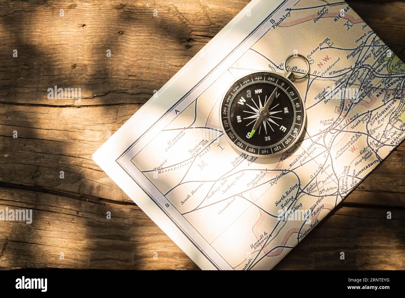 Map compass with wooden background Stock Photo