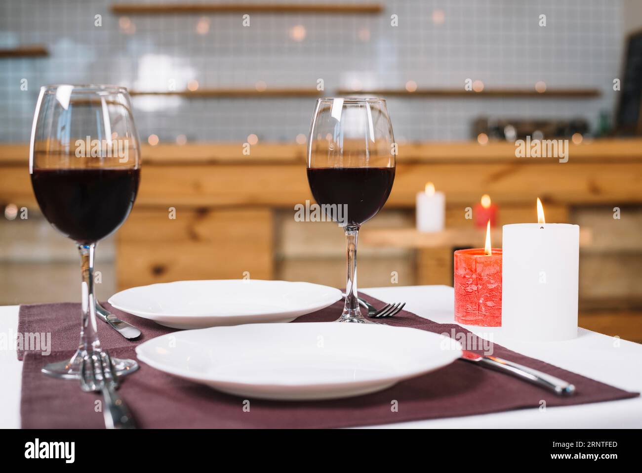 Romantic dinner table with wine glasses Stock Photo