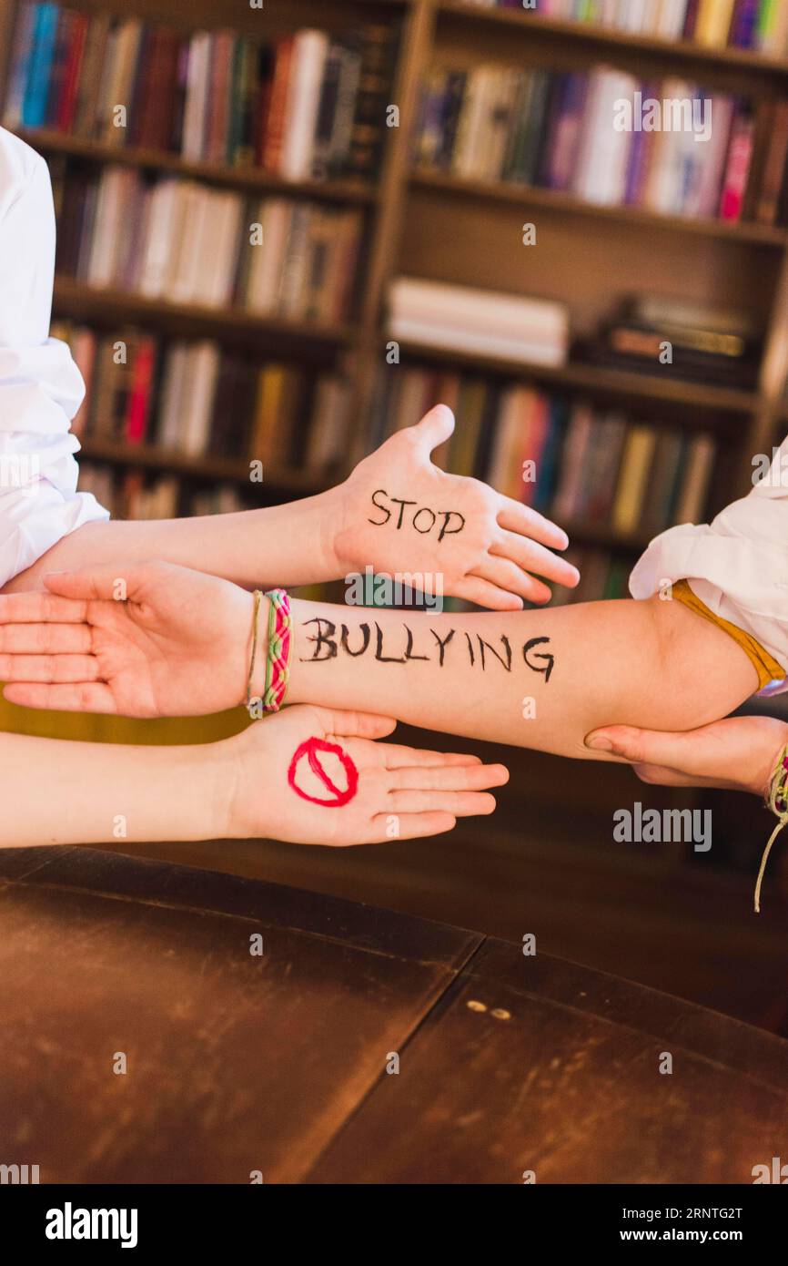 Stop bullying slogan children s arms Stock Photo