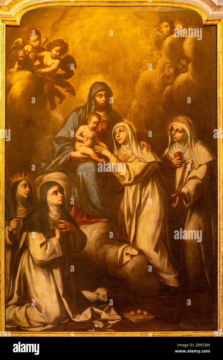 NAPLES, ITALY - APRIL 22, 2023: The painting of Madonna with saints women in the church Basilica dell Incoronata Madre del Buon Consiglio Stock Photo