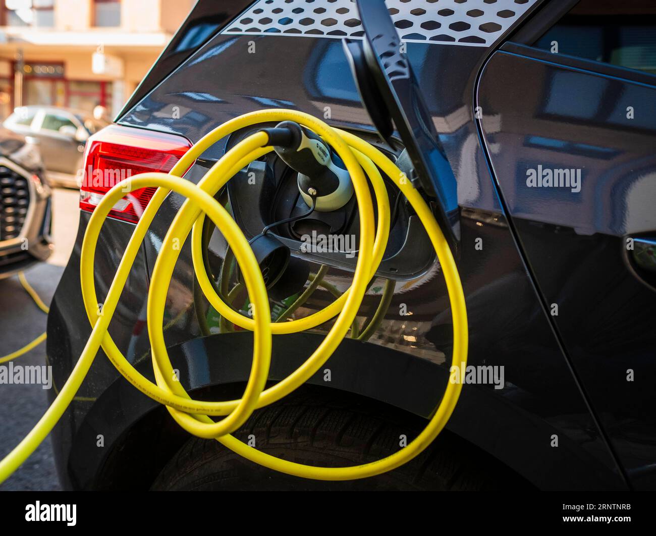An ecar charges at a public charging station in Duesseldorf, the