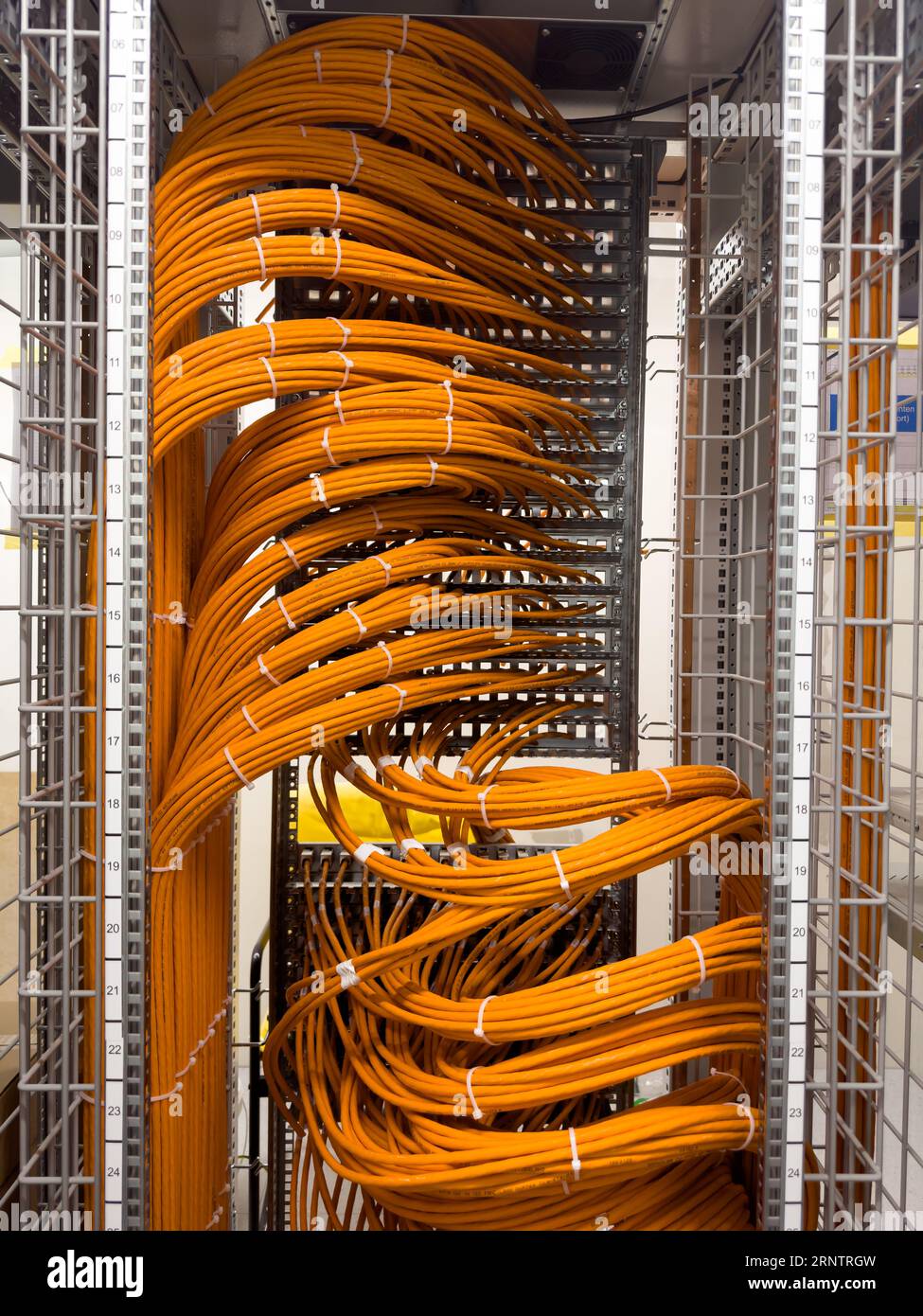 Fiber optic cables in a network rack Stock Photo