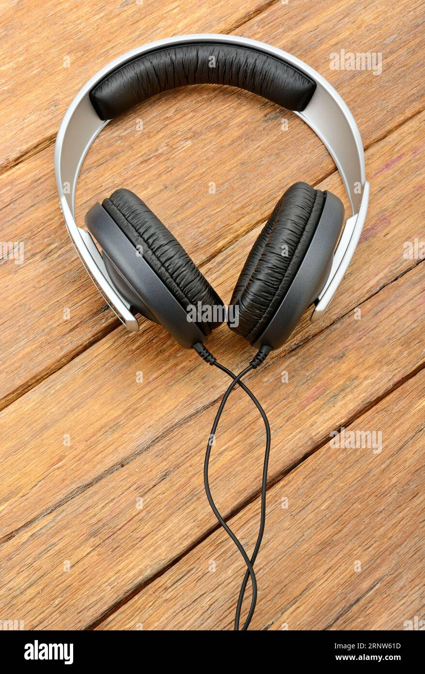 Single headphones on table hi res stock photography and images Alamy