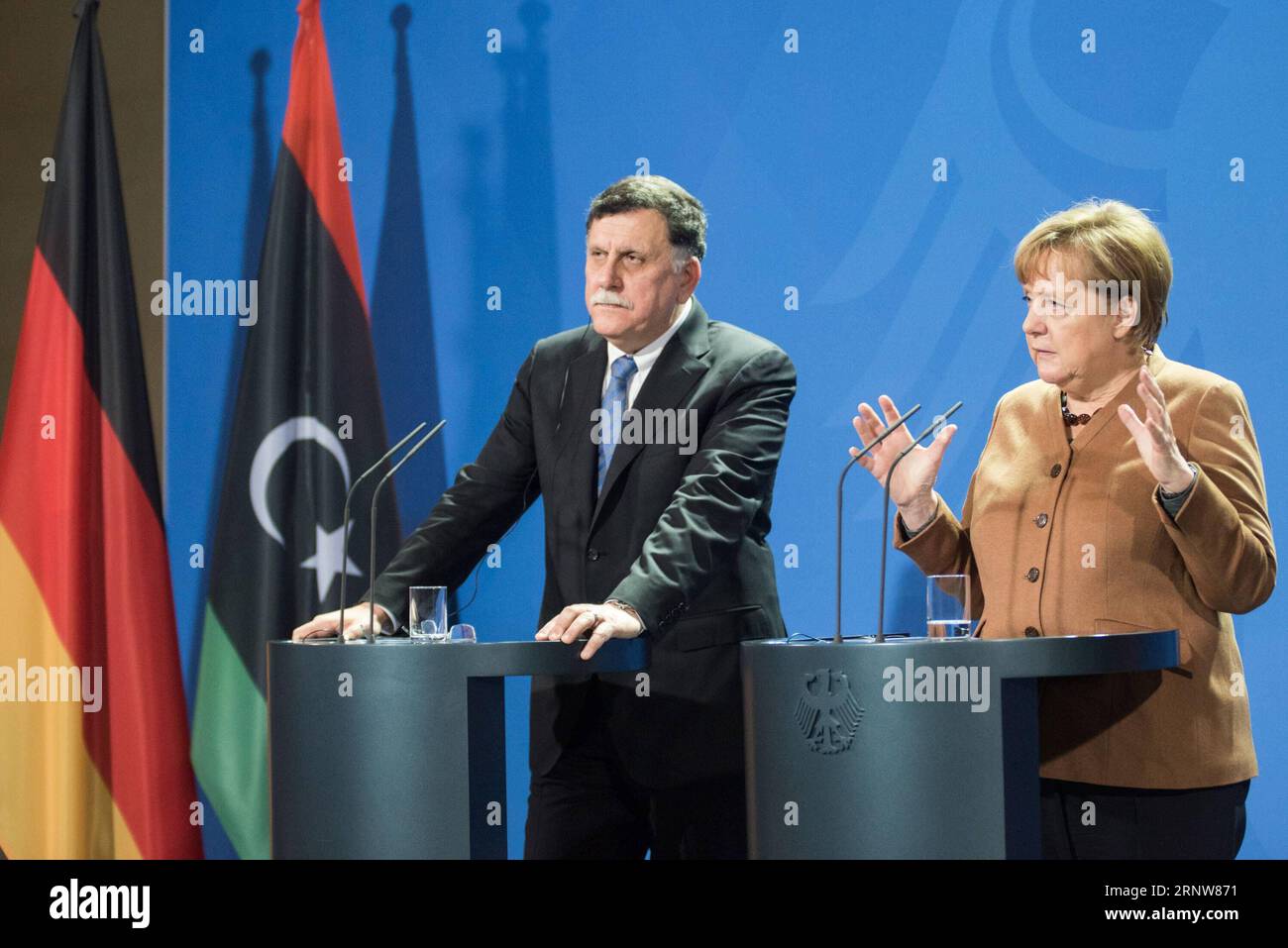 (171207) -- BERLIN, Dec. 7, 2017 -- German Chancellor Angela Merkel (R) addresses a press conference with visiting Libyan UN-backed Prime Minister Fayez al-Sarraj in Berlin, Germany, on Dec. 7, 2017. Merkel, after talks with Fayez al-Sarraj on Thursday, urged the Libyan authorities to improve the conditions of migrants in the North African country and pledged more support from the European Union. ) GERMANY-BERLIN-CHANCELLOR-LIBYA-UN-BACKED PM-MEETING ZhangxYuan PUBLICATIONxNOTxINxCHN Stock Photo