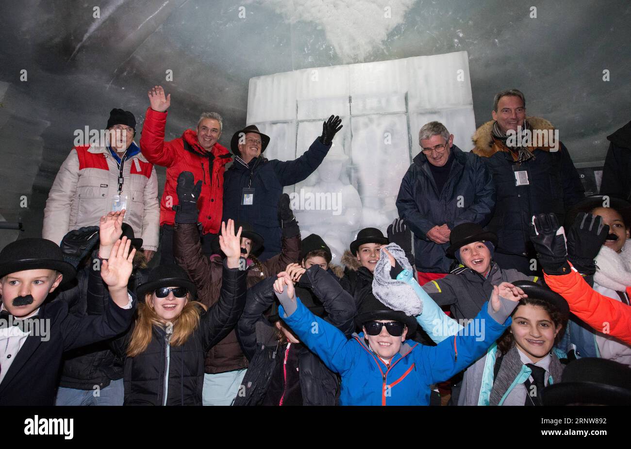 (171207) -- INTERLAKEN (SWITZERLAND), Dec. 7, 2017 -- Eugene Chaplin (3rd L, rear), son of screen legend Charlie Chaplin, and British sculptor John Doubleday (2nd R, rear), attend the unveiling ceremony of ice sculpture of Chaplin on the Jungfraujoch saddle, near Interlaken, Switzerland, Dec. 7, 2017. The ice sculpture was made to mark the 40th anniversary of Charlie Chaplin s death. ) SWITZERLAND-INTERLAKEN-CHAPLIN-ICE SCULPTURE-UNVEILING XuxJinquan PUBLICATIONxNOTxINxCHN Stock Photo