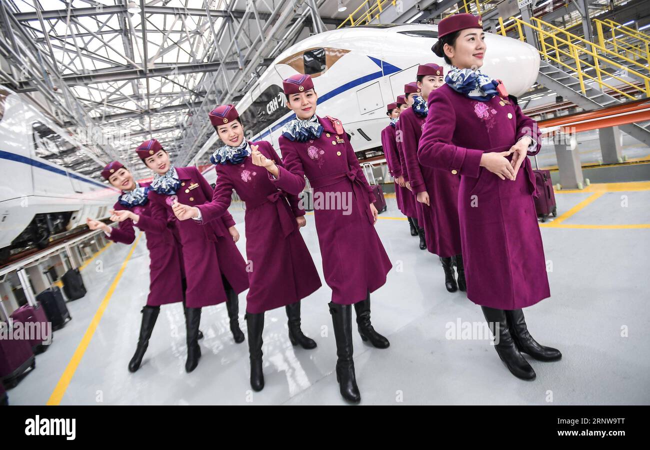 (171210) -- BEIJING, Dec. 10, 2017 -- Crew members of a bullet train ...