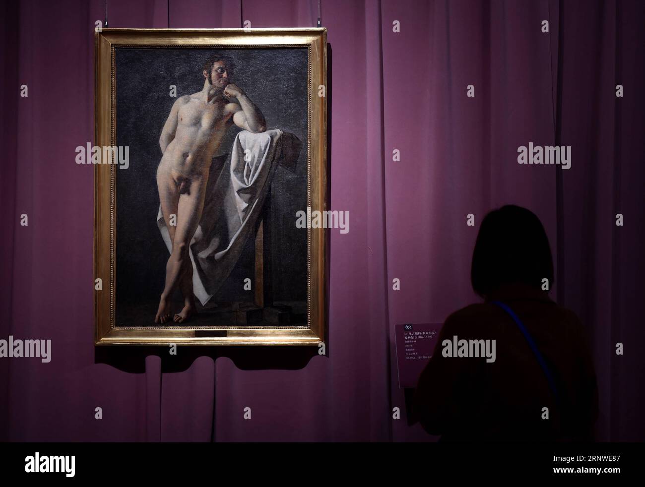 (171216) -- BEIJING, Dec. 16, 2017 -- A visitor looks at a painting of French artist Jean-Auguste-Dominique Ingres, at Beijing World Art Museum of the China Millennium Monument, in Beijing, capital of China, Dec. 16, 2017. Some 70 pieces of art works created by the renowned artist were exhibited here from this Saturday. ) (lb) CHINA-BEIJING-ART-INGRES-EXHIBITION (CN) LuoxXiaoguang PUBLICATIONxNOTxINxCHN Stock Photo