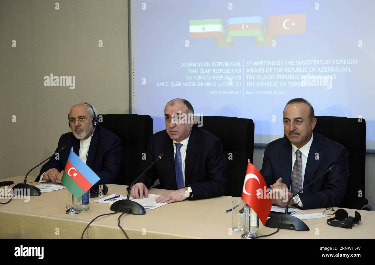 (171220) -- BAKU, Dec 20, 2017 -- Azerbaijani Foreign Minister Elmar Mammadyarov (C),Turkish Foreign Minister Mevlut Cavusoglu (R) and Iranian Foreign Minister Mohammad Javad Zarif attend a press conference after the fifth trilateral meeting of Azerbaijani, Iranian and Turkish Foreign Ministers in Baku, Azerbaijan, Dec 20, 2017.) AZERBAIJAN-BAKU-TRILATERAL FM MEETING TofikxBabayev PUBLICATIONxNOTxINxCHN Stock Photo