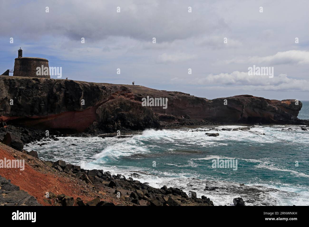 Crashing Atlantic waves, along the desolate coast at Torre Del Aguila-Castillo De Las Coloradas area, Lanzarote, Canary Islands, Spain Stock Photo