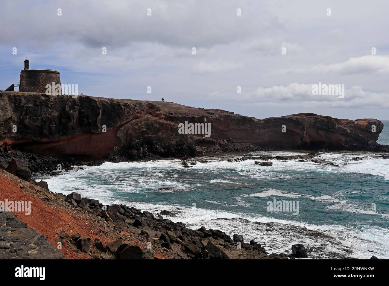 Crashing Atlantic waves, along the desolate coast at Torre Del Aguila-Castillo De Las Coloradas area, Lanzarote, Canary Islands, Spain Stock Photo