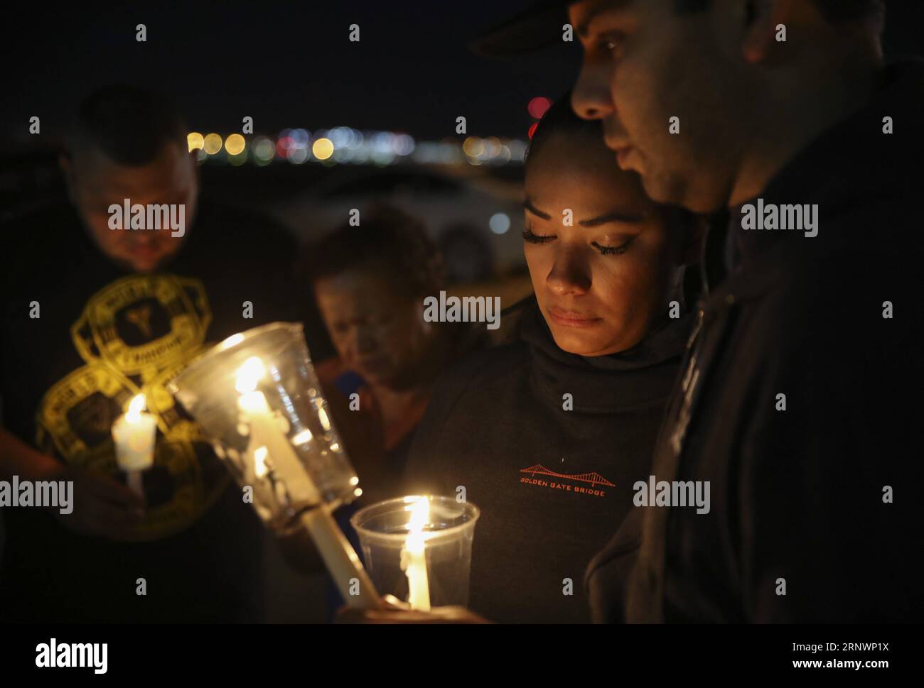 (171227) -- NEW YORK, Dec. 27, 2017 -- People attend a candle light vigil to mourn the victims of a mass shooting in Las Vegas, the United States, Oct. 2, 2017. At least 58 people were killed and 527 others wounded after a gunman opened fire on Oct. 1, 2017 during a concert in Las Vegas in the U.S. state of Nevada, the deadliest mass shooting in modern U.S. history. From Las Vegas shooting spree to Manhattan s truck attack, from Texas Hurricane Harvey to California s wildfires, from the advancing bull stock market to once-in-a-century total solar eclipse across U.S., seventeen photos covered t Stock Photo