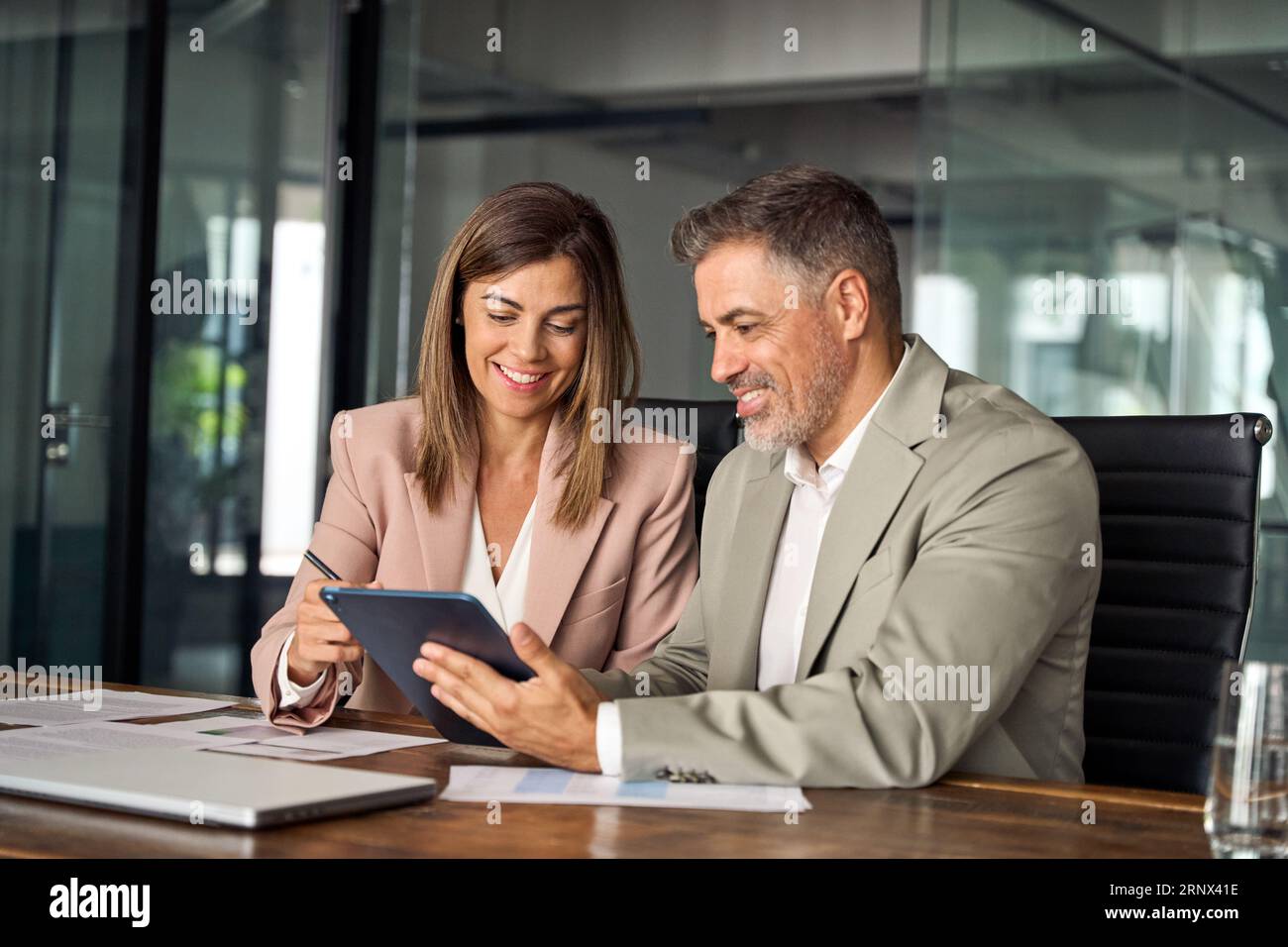 Professional business managers working using tablet at office meeting. Stock Photo