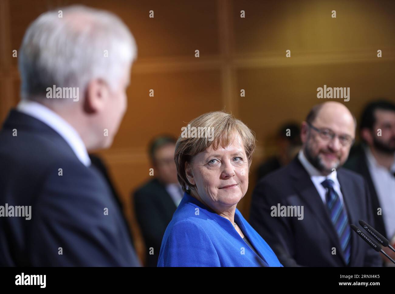 (180112) -- BERLIN, Jan. 12, 2018 -- German Chancellor and leader of German Christian Democratic Union (CDU) Angela Merkel (C), leader of German Christian Social Union (CSU) Horst Seehofer (L) and leader of German Social Democratic Party (SPD) Martin Schulz attend a joint press conference after coalition talks at the headquarters of SPD, in Berlin, Germany, on Jan. 12, 2018. German Chancellor Angela Merkel s conservatives and the Social Democrats (SPD) on Friday achieved a breakthrough in their exploratory talks aimed at forming a new coalition government, local media reported. )(srb) GERMANY- Stock Photo