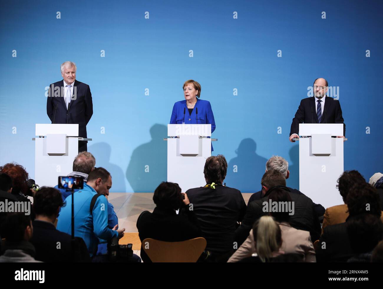 (180112) -- BERLIN, Jan. 12, 2018 -- German Chancellor and leader of German Christian Democratic Union (CDU) Angela Merkel (C), leader of German Christian Social Union (CSU) Horst Seehofer (L) and leader of German Social Democratic Party (SPD) Martin Schulz attend a joint press conference after coalition talks at the headquarters of SPD, in Berlin, Germany, on Jan. 12, 2018. German Chancellor Angela Merkel s conservatives and the Social Democrats (SPD) on Friday achieved a breakthrough in their exploratory talks aimed at forming a new coalition government, local media reported. )(srb) GERMANY- Stock Photo