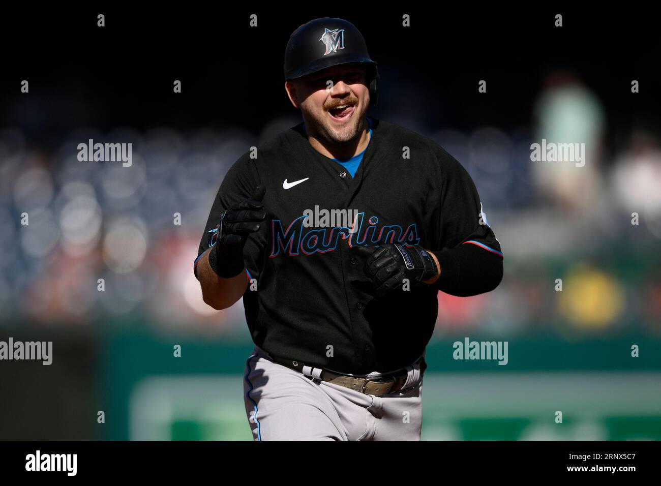 Miami Marlins' Jake Burger reacts as he rounds the bases on his home run  during the third inning of a baseball game against the Washington  Nationals, Saturday, Sept. 2, 2023, in Washington. (
