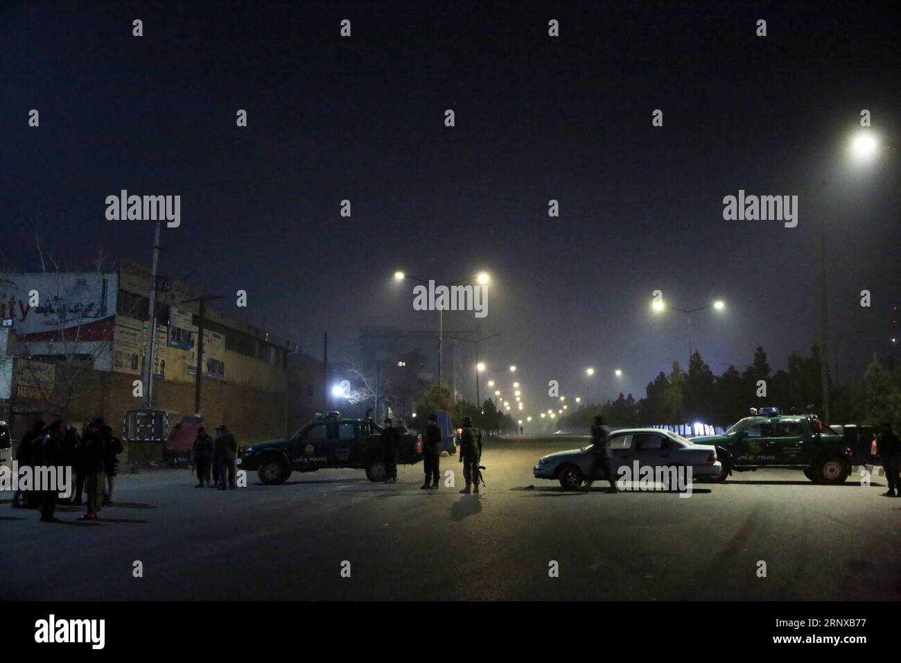 (180120) -- KABUL, Jan. 20, 2018 -- Security personnel cordon off the street near Kabul s Intercontinental Hotel in Kabul, Afghanistan, on Jan. 20, 2018. At least one attacker and several civilians were killed as a counter-attack was underway in Kabul s Intercontinental Hotel Saturday night following a terror attack there, a source said. ) AFGHANISTAN-KABUL-INTERCONTINENTAL HOTEL-ATTACK RahmatxAlizadah PUBLICATIONxNOTxINxCHN Stock Photo