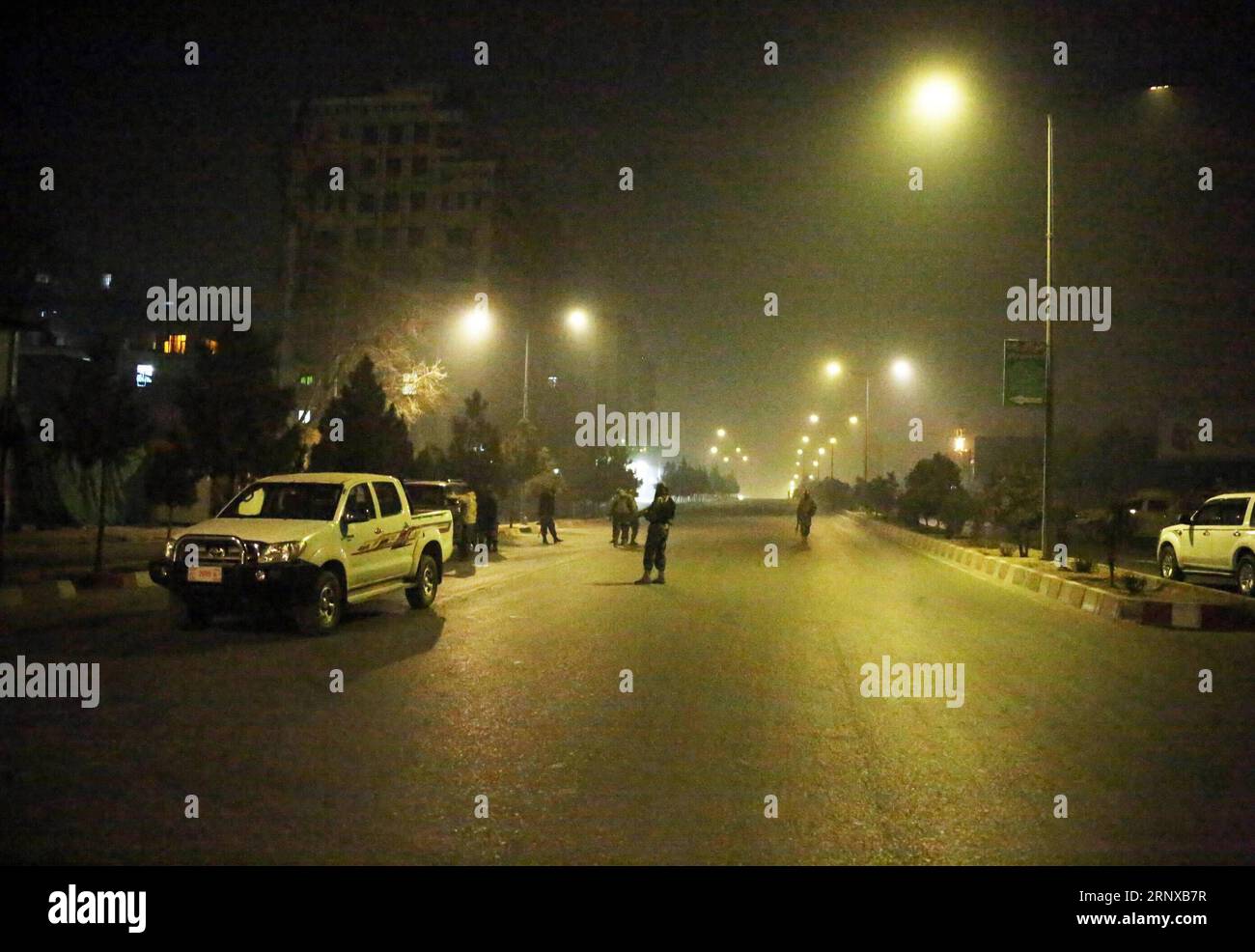 (180120) -- KABUL, Jan. 20, 2018 -- Security personnel cordon off the street near Kabul s Intercontinental Hotel in Kabul, Afghanistan, on Jan. 20, 2018. At least one attacker and several civilians were killed as a counter-attack was underway in Kabul s Intercontinental Hotel Saturday night following a terror attack there, a source said. ) AFGHANISTAN-KABUL-INTERCONTINENTAL HOTEL-ATTACK RahmatxAlizadah PUBLICATIONxNOTxINxCHN Stock Photo