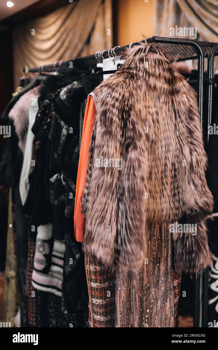 Coats hanging on a rack hi-res stock photography and images - Alamy