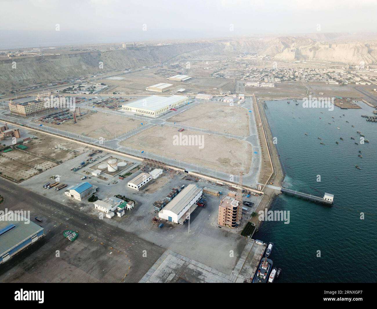 (180129) -- GWADAR, Jan. 29, 2018 -- Photo taken on Jan. 29, 2018 shows a view of Gwadar free zone in southwest Pakistan s Gwadar. The first phase of Gwadar Port s Free Zone in southwestern Pakistan was inaugurated on Monday by Prime Minister Shahid Khaqan Abbasi, who commented that the free zone would help facilitate regional and global trade under the China-Pakistan Economic Corridor (CPEC). ) (psw) PAKISTAN-GWADAR-FREE ZONE AhmadxKamal PUBLICATIONxNOTxINxCHN Stock Photo