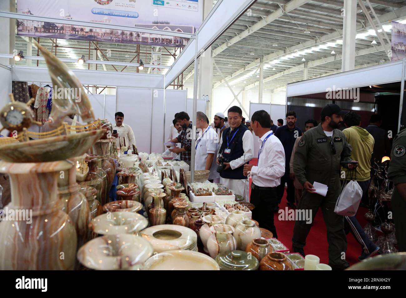 (180129) -- GWADAR (PAKISTAN), Jan. 29, 2018 -- People visit a stand at Gwadar Expo 2018 in Gwadar, southwest Pakistan, on Jan. 29, 2018. The first Gwadar International Expo kicked off in Gwadar Port s Free Zone on Monday and has attracted businessmen from Iran, China, Afghanistan. ) PAKISTAN-GWADAR-EXPO AhmadxKamal PUBLICATIONxNOTxINxCHN Stock Photo