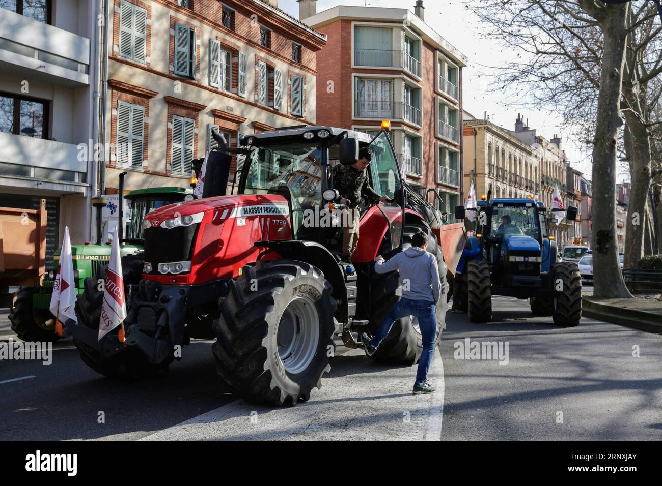 (180201) -- TOULOUSE, Feb. 1, 2018 -- Farmers and tractors are seen on a street during a demonstration in Toulouse, France, Jan. 31, 2018. Farmers set up a filter dam on Wednesday to slow down traffic to protest against the decrease of the subsidies allocated in the region. ) (gj) FRANCE-TOULOUSE-FARMERS-DEMONSTRATION JosexSantos PUBLICATIONxNOTxINxCHN Stock Photo