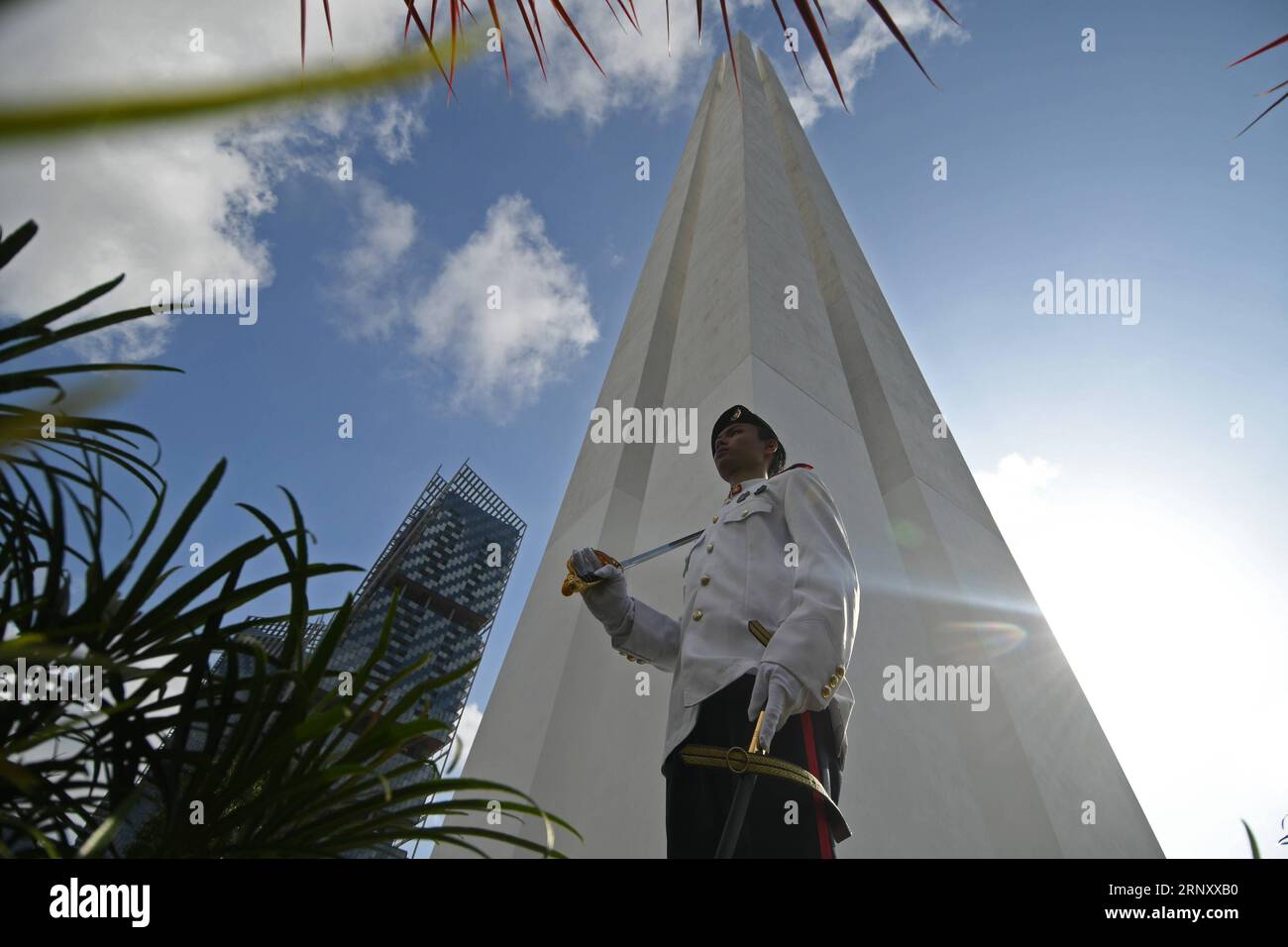 (180215) -- SINGAPORE, Feb. 15, 2018 -- A National Cadet Corp (NCC) student cadet stands on post during the war memorial service held at the War Memorial Park in Singapore on Feb. 15, 2018. Singapore Thursday held the 51st War Memorial Service in commemoration of the civilian victims of the Japanese Occupation and Total Defence Day Commemoration event. ) (zf) SINGAPORE-WAR-MEMORIAL-JAPANESE OCCUPATION ThenxChihxWey PUBLICATIONxNOTxINxCHN Stock Photo