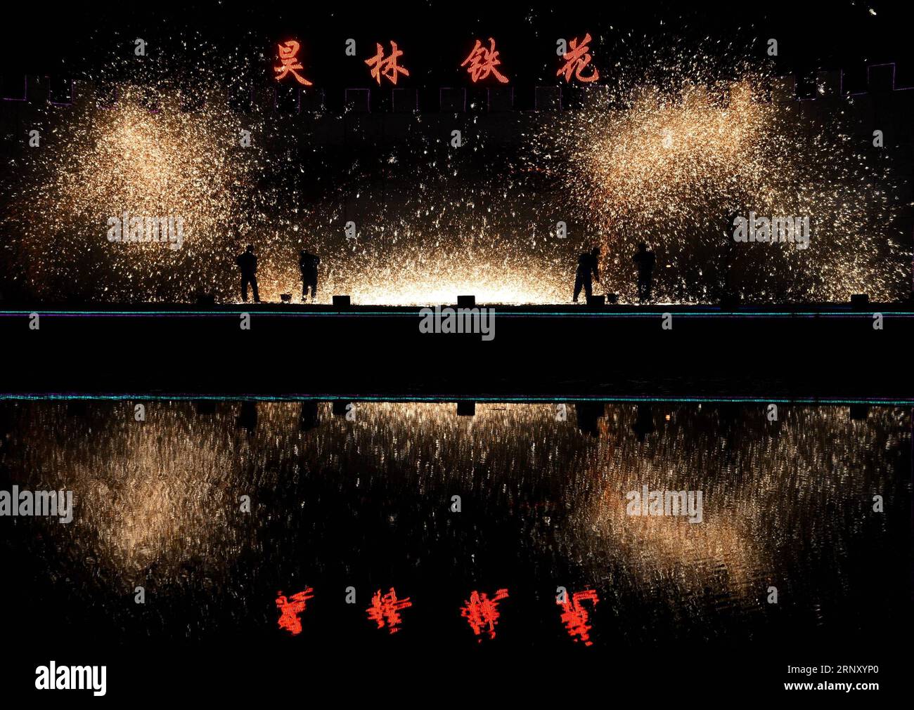 (180218) -- SHIJIAZHUANG, Feb. 18, 2018 -- Sparks pour down as performers spray burning iron chips to shower sparks-like fireworks in Cixian County, north China s Hebei Province, Feb. 17, 2018. The performance was held to celebrate the Spring Festival, or the Chinese Lunar New Year, which fell on Feb. 16 this year. ) (ry) CHINA-HEBEI-IRON SPARKS (CN) WangxXiao PUBLICATIONxNOTxINxCHN Stock Photo