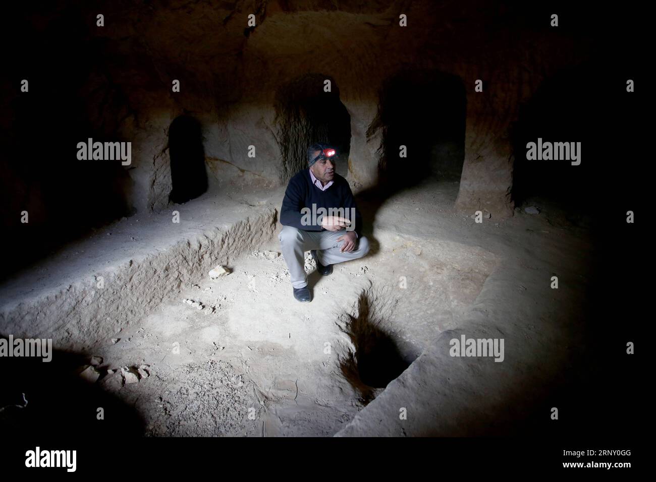 (180219) -- NABLUS, Feb. 19, 2018 -- Palestinian engineer Mahmoud Biraoui inspects a newly-discovered cemetery in the West Bank city of Nablus, on Feb. 19, 2018. Palestinian Ministry of Tourism and Antiquities said Friday it has uncovered a new historical cemetery that belongs to the Byzantine era near the West Bank city of Nablus.) (srb) MIDEAST-NABLUS-ARCHAEOLOGY-CEMETERY NidalxEshtayeh PUBLICATIONxNOTxINxCHN Stock Photo