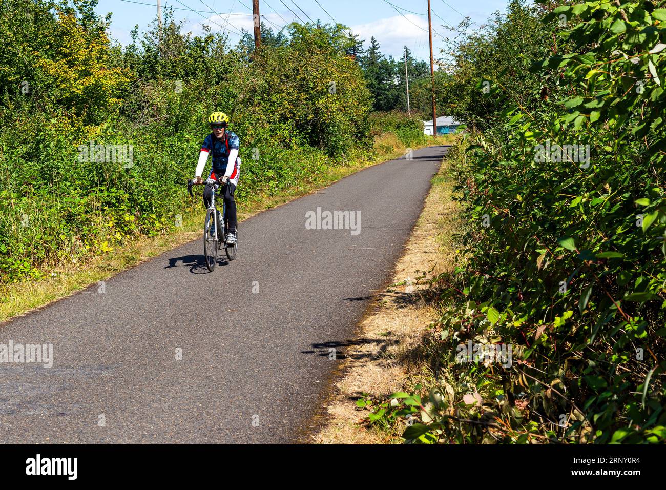 Cyclist riding on the Springwater Corridor Trail, a rail trail in