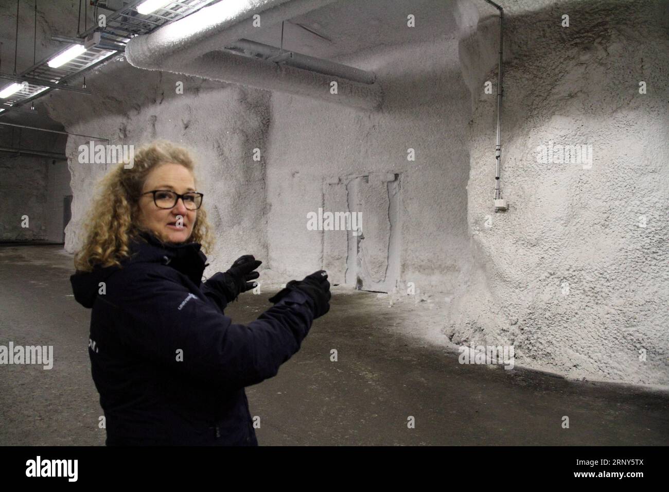 (180301) -- SVALBARD, March 1, 2018 -- Lise Lykke Steffensen, director of the Nordic Genetic Resource Center, gestures at Svalbard Global Seed Vault on Norway s remote Arctic archipelago of Svalbard on Feb. 27, 2018. The underground agricultural seed bank in Norway will receive a 13-million-U.S.-dollar grant for upgrade as it celebrates its 10th anniversary this year, the Norwegian government has said. The Svalbard Global Seed Vault, dubbed the Doomsday and the Noah s Ark vault, was established as a backup of crop seed samples stored in other seed banks around the world. It is considered to be Stock Photo