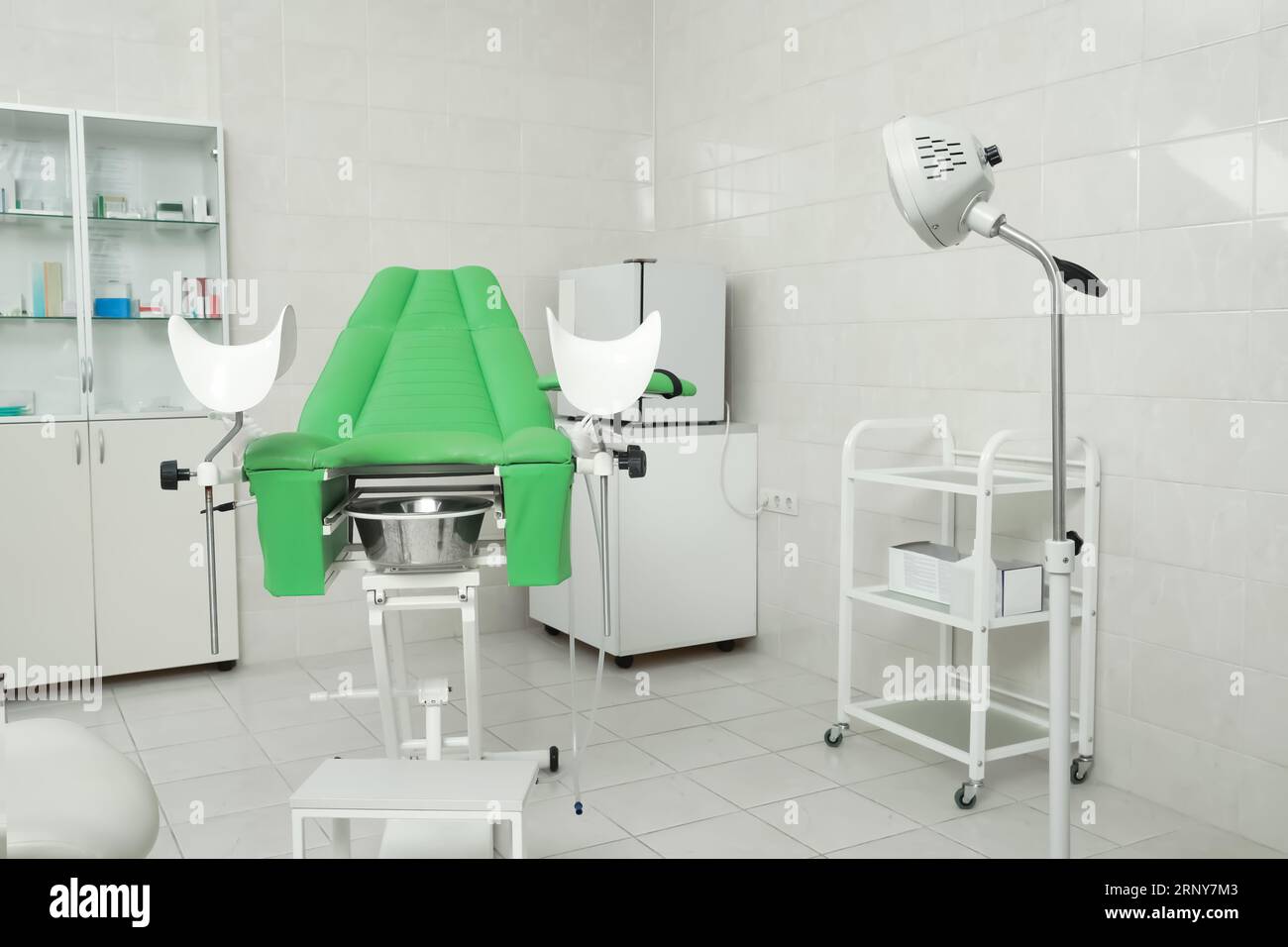Modern gynecological office interior with examination chair and medical ...