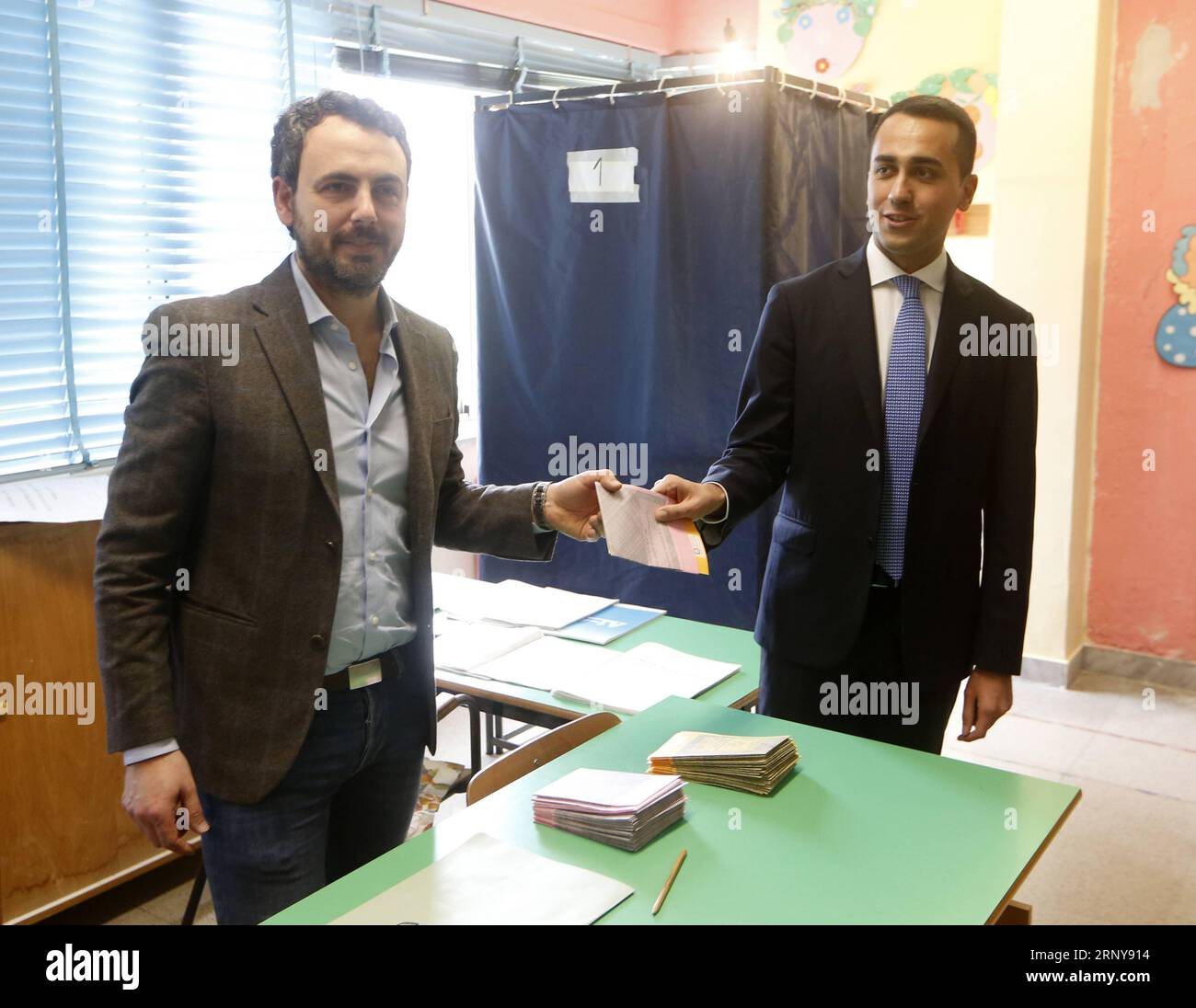 (180304) -- MILAN, March 4, 2018 () -- The Five Star Movement leader Luigi Di Maio (R) casts his vote at a polling station in Pomigliano d Arco, near Naples, Italy, March 4, 2018. Italians started to cast their ballots Sunday morning leading to the election of a prime minister, two days after politicians made their final campaign for the general election. () (whw) ITALY-NAPLES-GENERAL ELECTION Xinhua PUBLICATIONxNOTxINxCHN Stock Photo