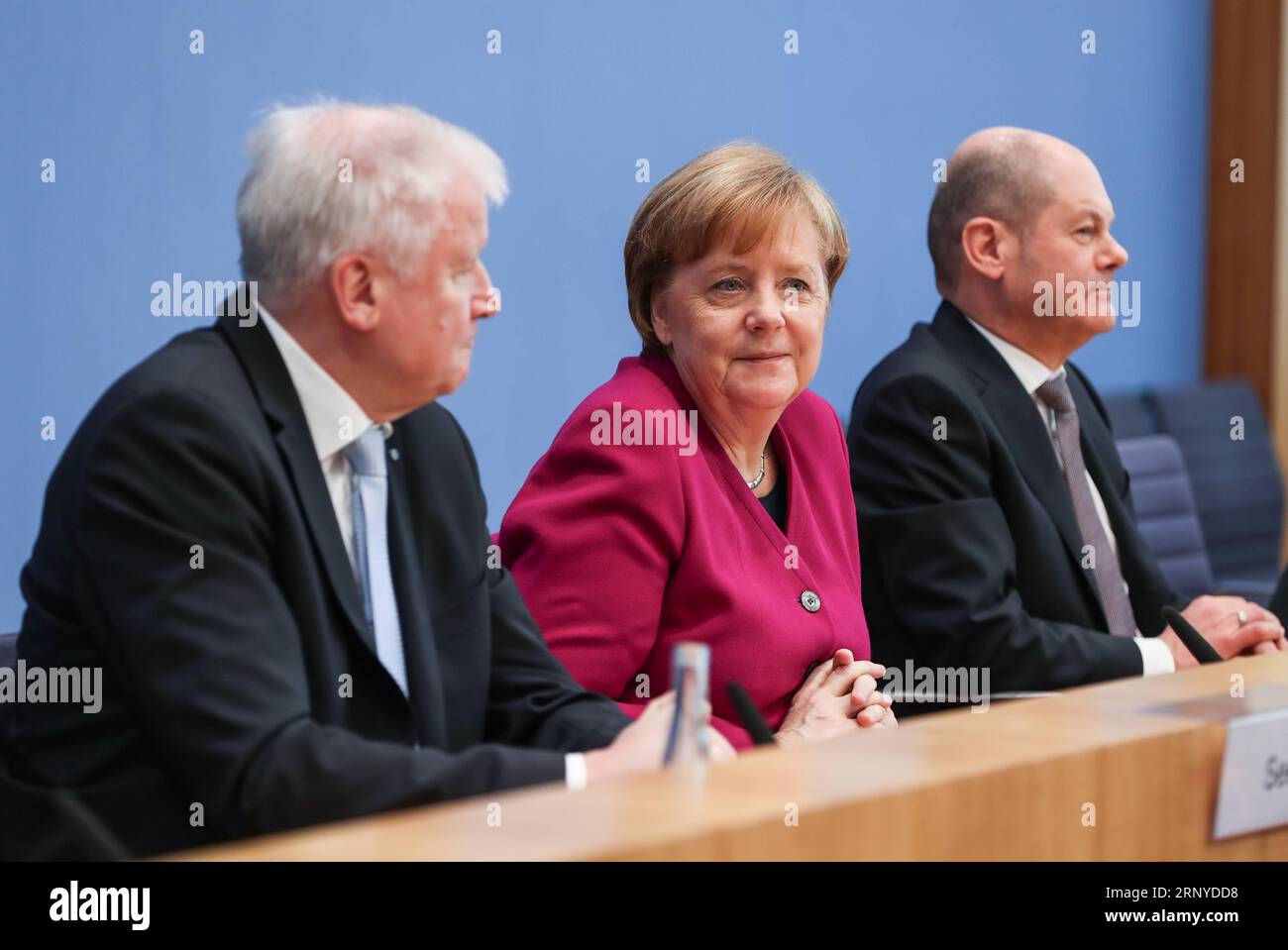 (180312) -- BERLIN, March 12, 2018 -- German Chancellor and Christian Democratic Union (CDU) leader Angela Merkel (C), interim German Social Democrats (SPD) leader Olaf Scholz (R) and Christian Social Union (CSU) leader Horst Seehofer attend a press conference in Berlin, capital of Germany, on March 12, 2018. The leaders of the Christian Democratic Union (CDU), Christian Social Union (CSU) and German Social Democrats (SPD) revealed the key priorities of Germany s new federal government on Monday. ) GERMANY-BERLIN-GRAND COALITION-AGREEMENT ShanxYuqi PUBLICATIONxNOTxINxCHN Stock Photo