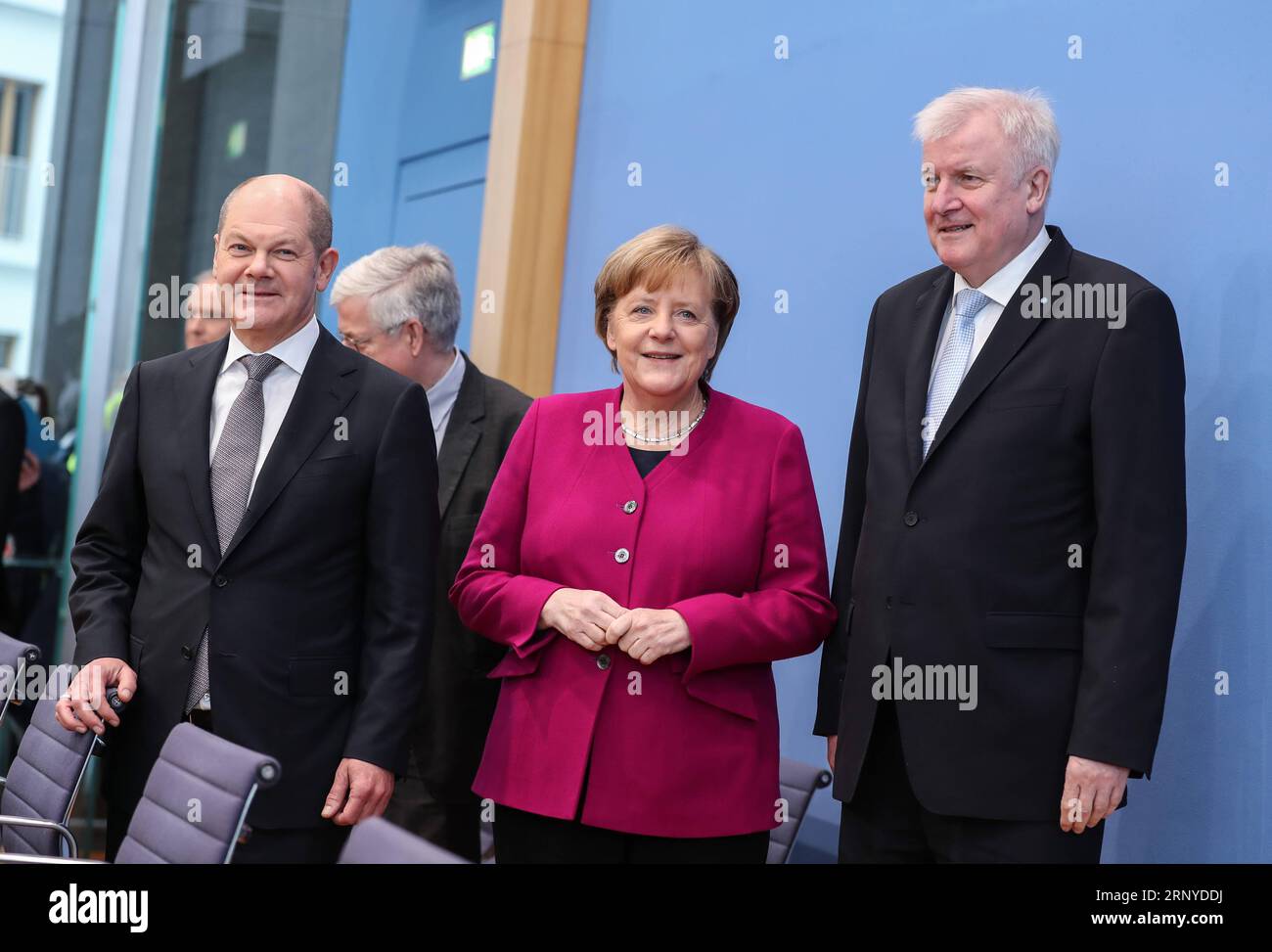 (180312) -- BERLIN, March 12, 2018 -- German Chancellor and Christian Democratic Union (CDU) leader Angela Merkel (C), interim German Social Democrats (SPD) leader Olaf Scholz (L, Front) and Christian Social Union (CSU) leader Horst Seehofer (R) arrive to attend a press conference in Berlin, capital of Germany, on March 12, 2018. The leaders of the Christian Democratic Union (CDU), Christian Social Union (CSU) and German Social Democrats (SPD) revealed the key priorities of Germany s new federal government on Monday. ) GERMANY-BERLIN-GRAND COALITION-AGREEMENT ShanxYuqi PUBLICATIONxNOTxINxCHN Stock Photo