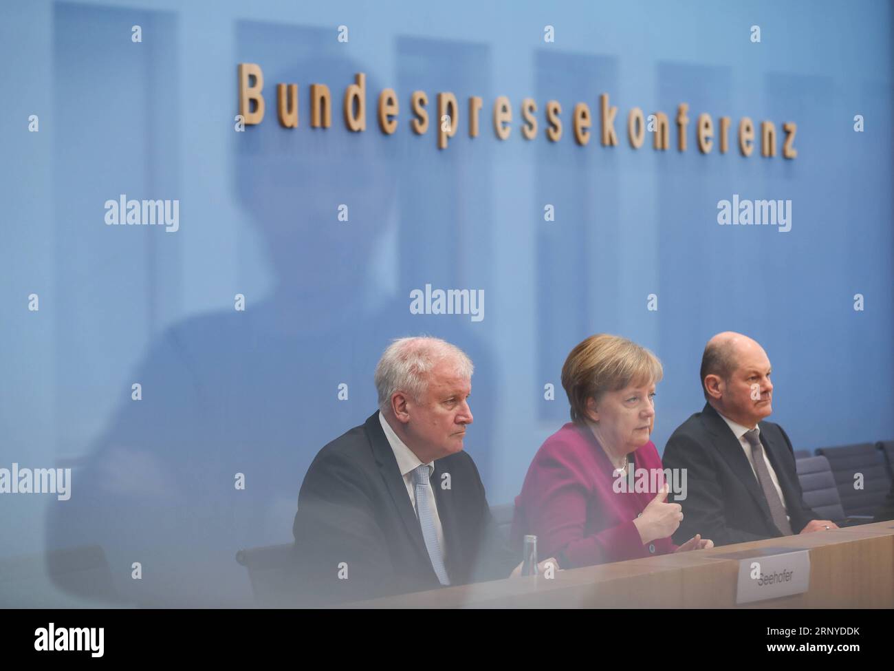 (180312) -- BERLIN, March 12, 2018 -- German Chancellor and Christian Democratic Union (CDU) leader Angela Merkel (C), interim German Social Democrats (SPD) leader Olaf Scholz (R) and Christian Social Union (CSU) leader Horst Seehofer attend a press conference in Berlin, capital of Germany, on March 12, 2018. The leaders of the Christian Democratic Union (CDU), Christian Social Union (CSU) and German Social Democrats (SPD) revealed the key priorities of Germany s new federal government on Monday. ) GERMANY-BERLIN-GRAND COALITION-AGREEMENT ShanxYuqi PUBLICATIONxNOTxINxCHN Stock Photo