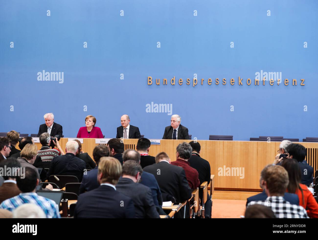(180312) -- BERLIN, March 12, 2018 -- German Chancellor and Christian Democratic Union (CDU) leader Angela Merkel (2nd L, rear), interim German Social Democrats (SPD) leader Olaf Scholz (2nd R, rear) and Christian Social Union (CSU) leader Horst Seehofer (1st L, rear) attend a press conference in Berlin, capital of Germany, on March 12, 2018. The leaders of the Christian Democratic Union (CDU), Christian Social Union (CSU) and German Social Democrats (SPD) revealed the key priorities of Germany s new federal government on Monday. ) GERMANY-BERLIN-GRAND COALITION-AGREEMENT ShanxYuqi PUBLICATION Stock Photo