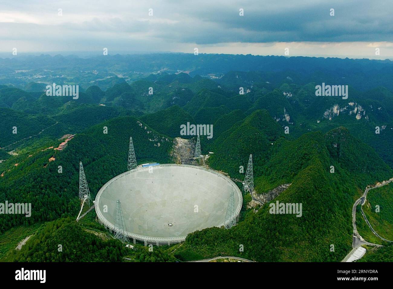 (180313) -- GUIYANG, March 13, 2018 -- File photo taken on Aug. 9, 2017, shows the Five-hundred-meter Aperture Spherical Radio Telescope (FAST) in Pingtang County, southwest China s Guizhou Province. China s FAST, the world s largest single-dish radio telescope, has discovered 11 new pulsars so far, the National Astronomical Observatories of China (NAOC) said Tuesday. )(wsw) CHINA-GUIZHOU-FAST-11 NEW PULSARS (CN) OuxDongqu PUBLICATIONxNOTxINxCHN Stock Photo