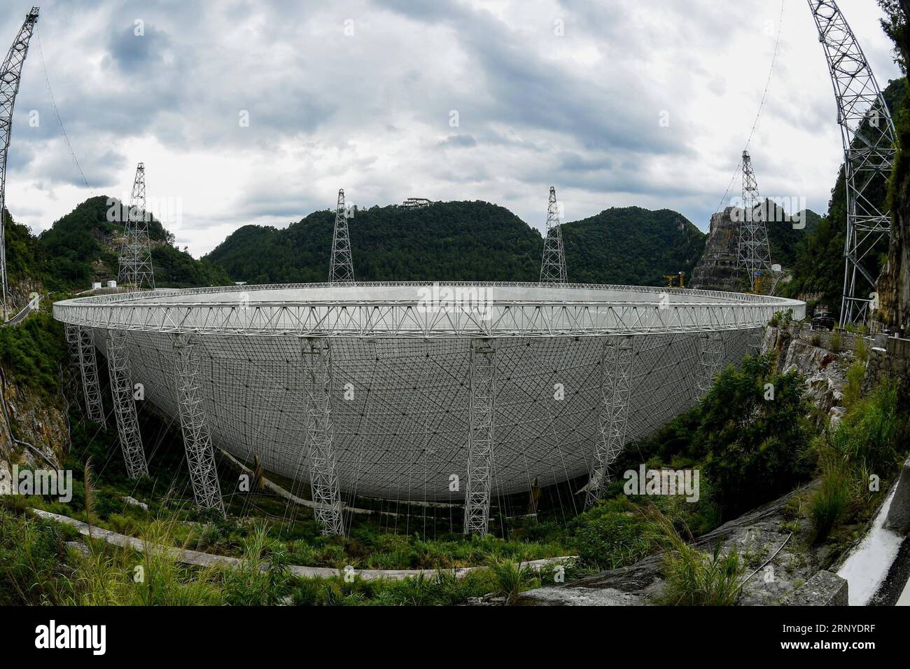(180313) -- GUIYANG, March 13, 2018 -- File photo taken on Aug. 9, 2017, shows the Five-hundred-meter Aperture Spherical Radio Telescope (FAST) in Pingtang County, southwest China s Guizhou Province. China s FAST, the world s largest single-dish radio telescope, has discovered 11 new pulsars so far, the National Astronomical Observatories of China (NAOC) said Tuesday. )(wsw) CHINA-GUIZHOU-FAST-11 NEW PULSARS (CN) OuxDongqu PUBLICATIONxNOTxINxCHN Stock Photo