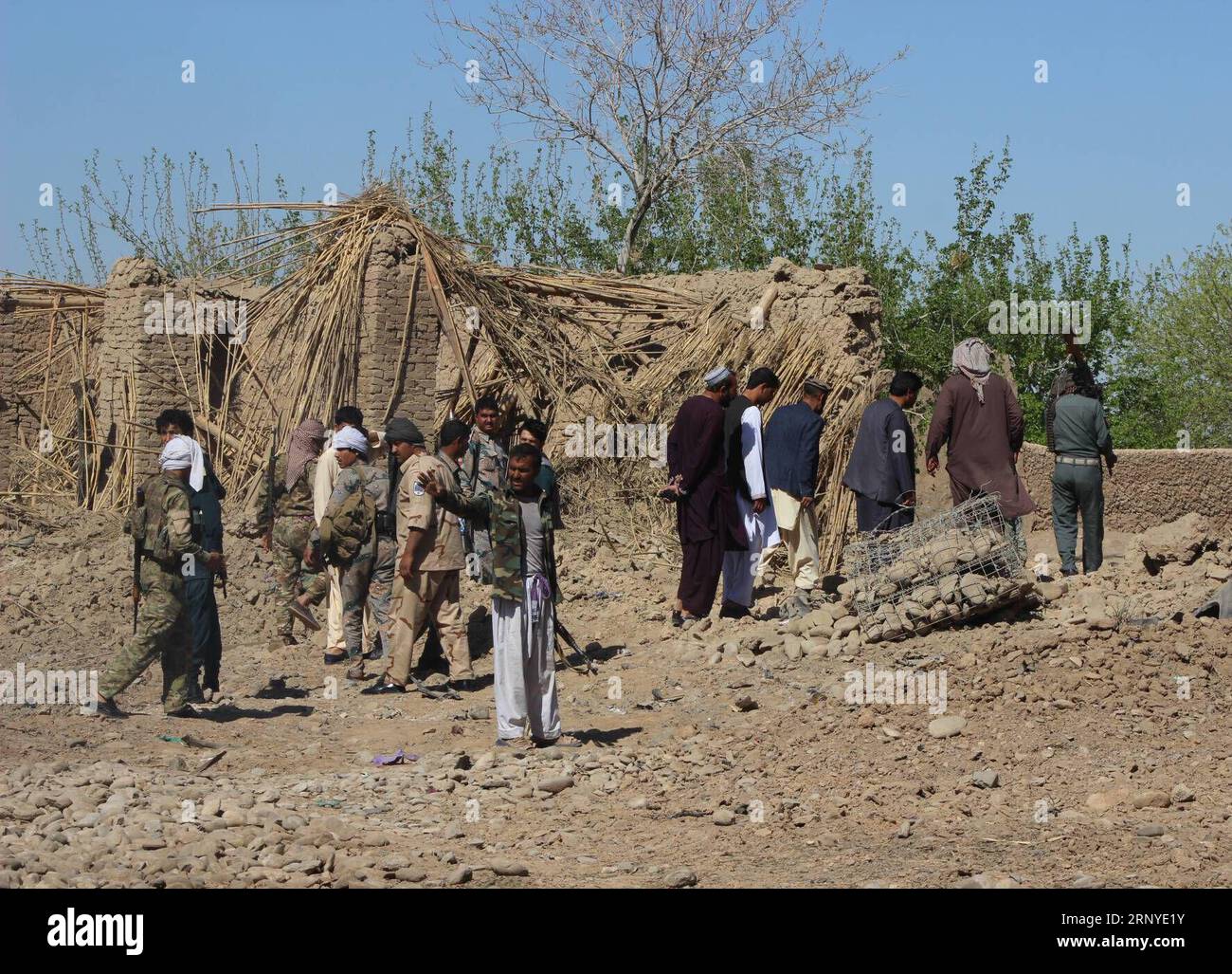 (180314) -- HELMAND, March 14, 2018 -- Afghan security force members inspect the site of attack in Nad Ali district of Helmand province, Afghanistan, March 14, 2018. At least two Afghan police personnel were killed and two others injured after a suicide car bombing struck a border police outpost in southern Helmand province on Wednesday, provincial government spokesman said. ) (djj) AFGHANISTAN-HELMAND-SUICIDE CAR BOMBING AbdulxAzizxSafdari PUBLICATIONxNOTxINxCHN Stock Photo