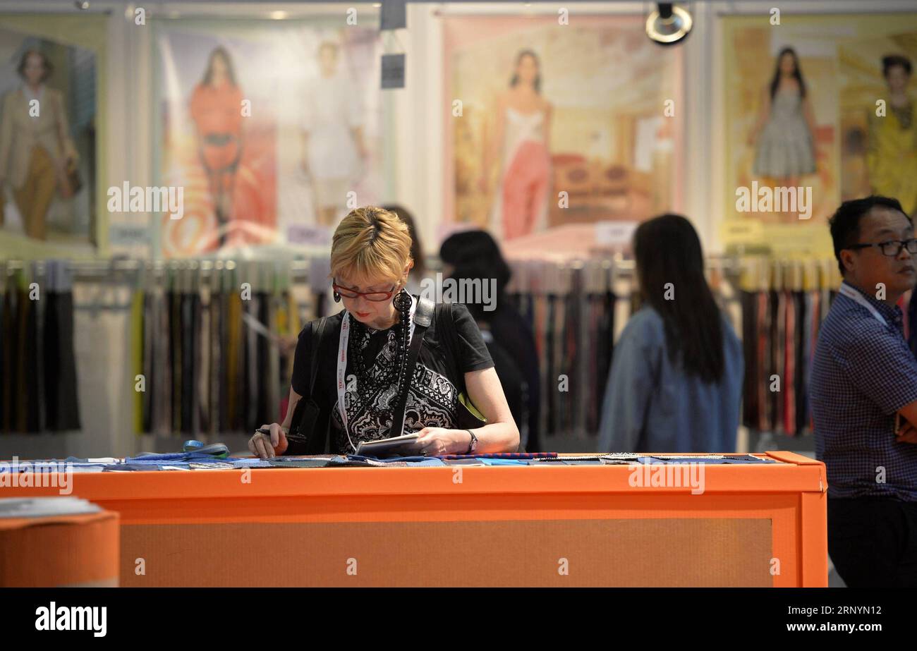 (180327) -- BEIJING, March 27, 2018 -- People visit the China Textile and Apparel Trade Show in New York, the United States, July 21, 2015. More than 600 enterprises from China showed their products at this Trade Show. A huge trade deficit with China is reportedly behind the U.S. administration s plan to slap tariffs on up to 60 billion U.S. dollars of Chinese imports and restrict Chinese investment. But data sometimes lies, and could shield the bigger picture. ) (djj) Xinhua Headlines: Truth behind China-U.S. trade imbalances WangxLei PUBLICATIONxNOTxINxCHN Stock Photo