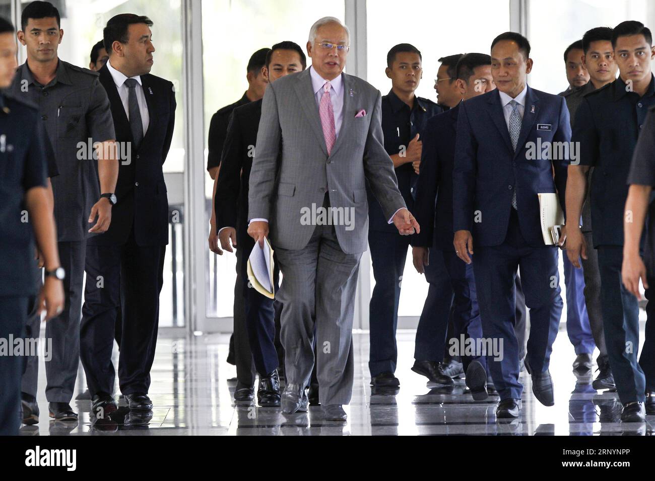 (180328) -- KUALA LUMPUR, March 28, 2018 -- Malaysian Prime Minister Najib Razak (C) arrives at the Parliament in Kuala Lumpur, Malaysia, March 28, 2018. The Malaysian parliament on Wednesday passed a motion to redraw the electoral map, as both the ruling Barisan Nasional (BN) coalition and the opposition parties are gearing up to contest the 222 seats nationwide in a general election expected to take place in the next few weeks. ) (srb) MALAYSIA-KUALA LUMPUR-ELECTION-PROTEST ChongxVoonxChung PUBLICATIONxNOTxINxCHN Stock Photo