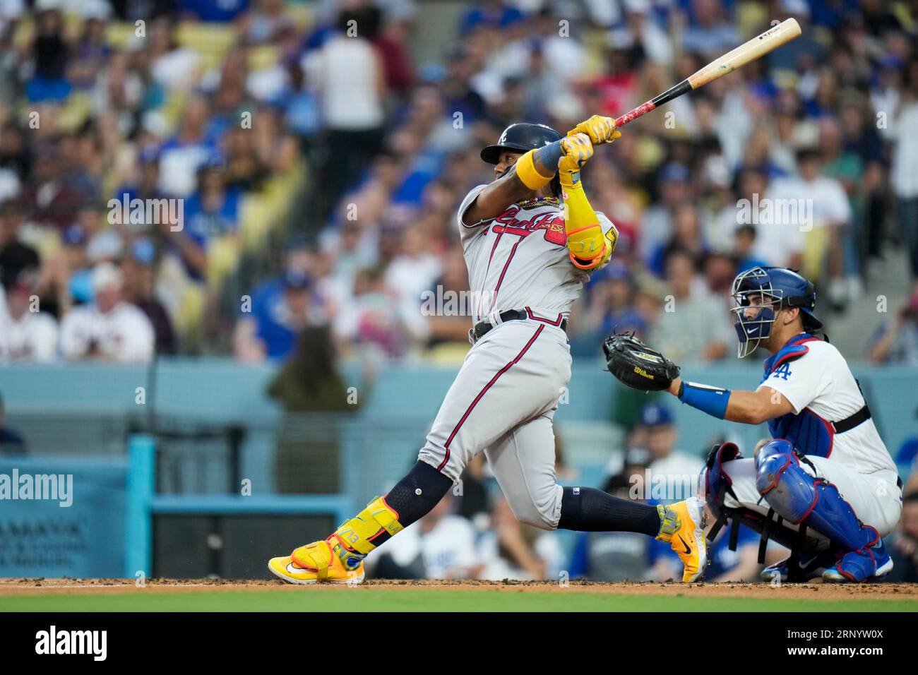 Atlanta Braves' Ronald Acuña Jr. follows through on a home run against